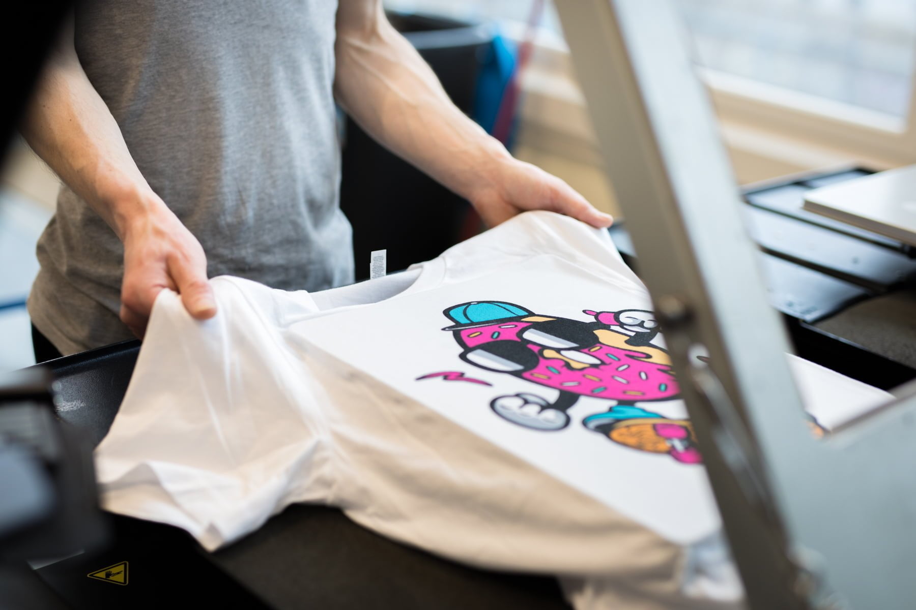 removing a printed tshirt from the printer