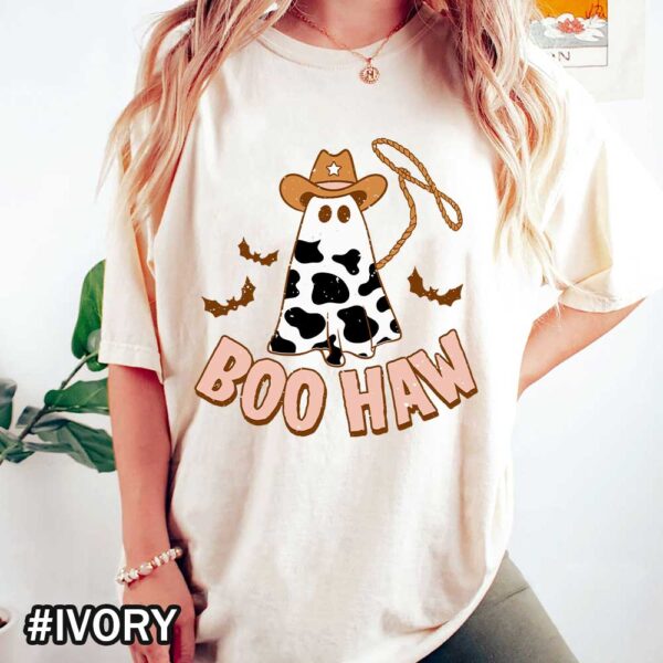 Boo Haw Halloween T-Shirt featuring a cow in a cowboy hat throwing a rope