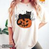 Black Cat Sitting on a Jack-O-Lantern Halloween T-Shirt