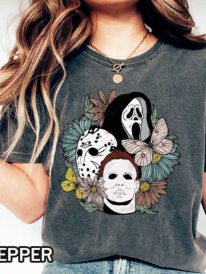 Retro Vintage Halloween T-Shirt - GhostFace, Michael Myers, Jason Voorhees Retro Vintage Halloween T-Shirt featuring GhostFace, Michael Myers, and Jason Voorhees faces from floral background