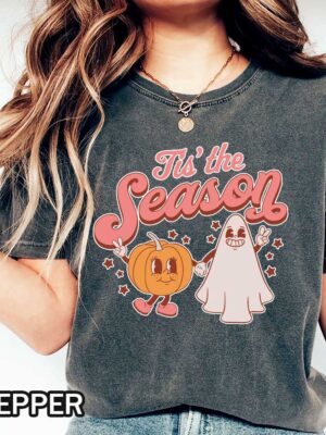 Fall Tis The Season Comfort Colors T-Shirt Fall Tis The Season Comfort Colors T-Shirt featuring a ghost and pumpkin