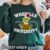 Grinch Whoville University Sweatshirt featuring Grinch in a leopard costume and Santa hat