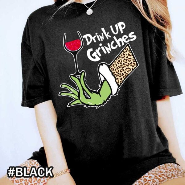 Black Comfort Colors Grinch Wine Shirt That Says Drink Up Grinches Drink Up Grinches! Leopard Grinch Wine Christmas Shirt