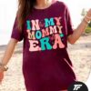 A vintage-style T-shirt with the phrase "In My Mommy Era," perfect for moms and Mother's Day gifts